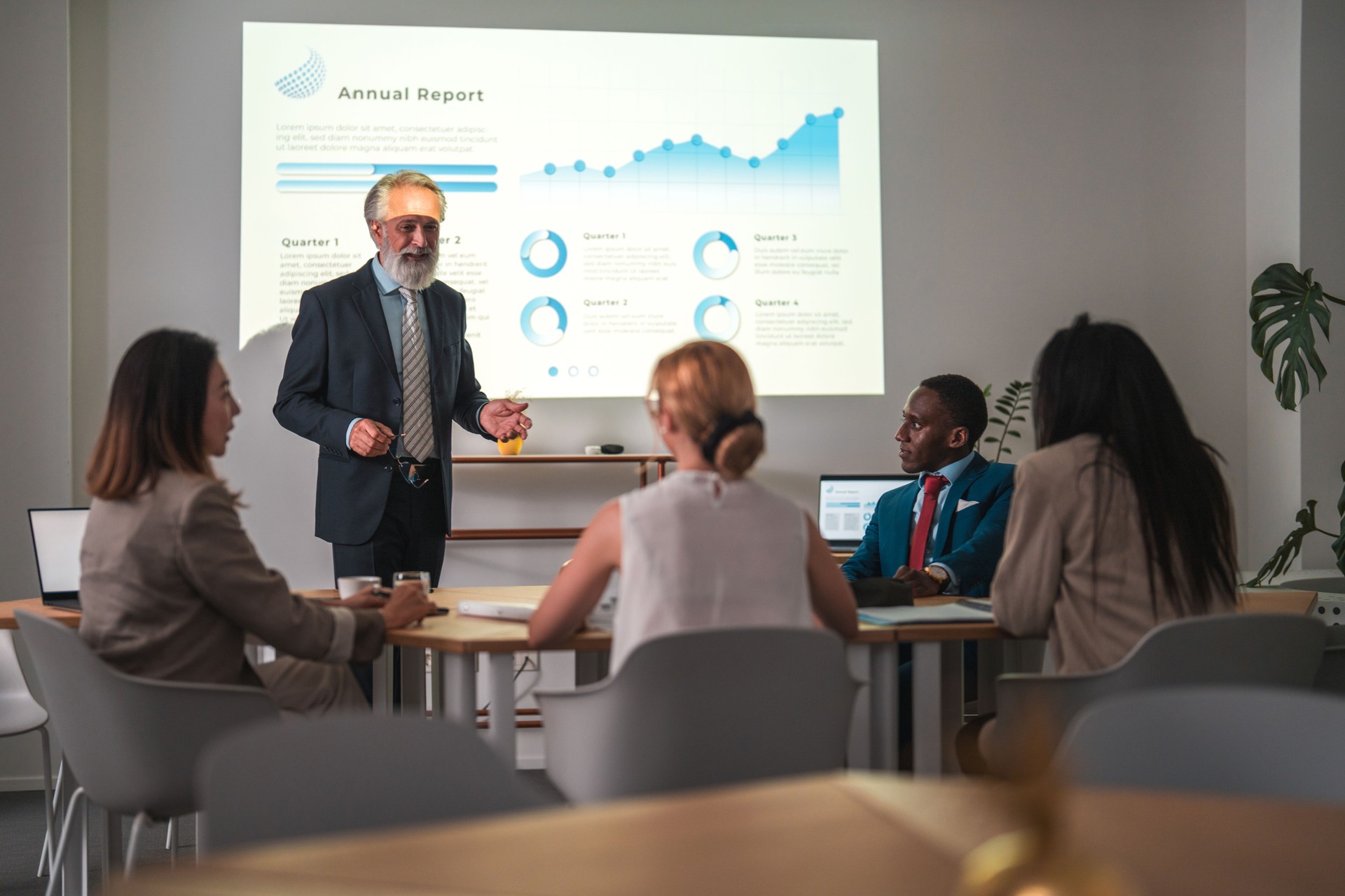 Mature Caucasian Manager Leading Explaining Marketing Trends